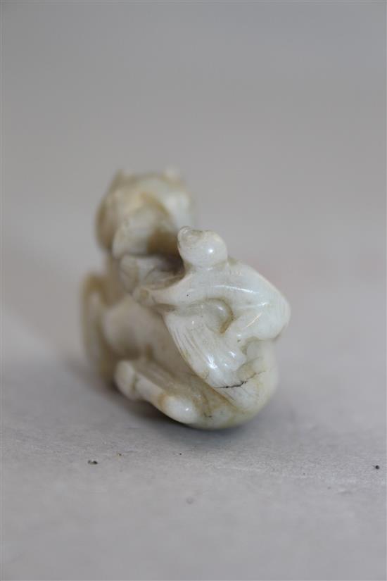 A Chinese white and black jade group of a monkey and a recumbent horse, 19th century, 4cm.